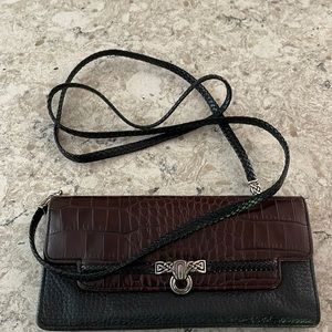 Brighton cross body wallet. Sterling accents. Black pebble and brown croc.